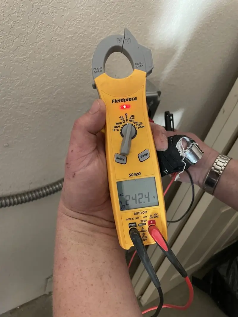 Voltage testing with clamp meter during Aluminum Wiring Replacement in Caledonia